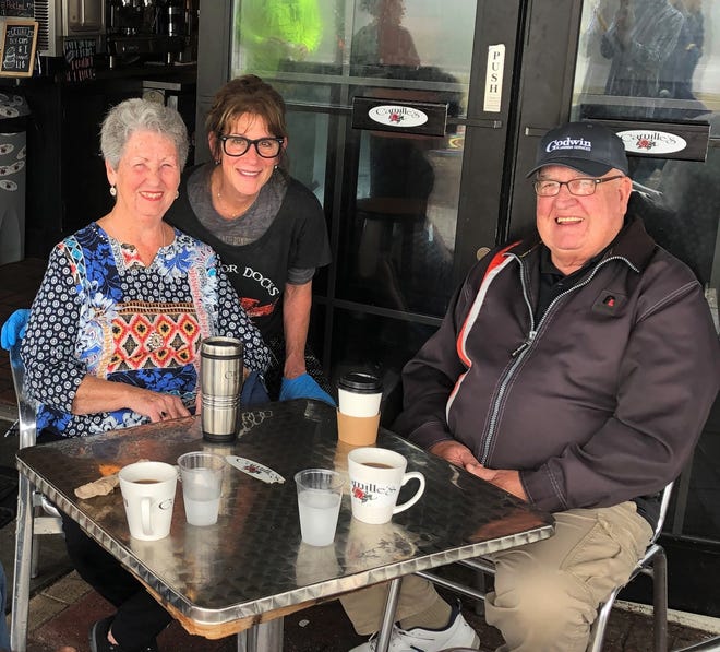 Marla Howerton, manager at Camille’s, welcomes Carol and Pat Kelly, snowbirds from Caledonia, Michigan. [CONTRIBUTED PHOTO]