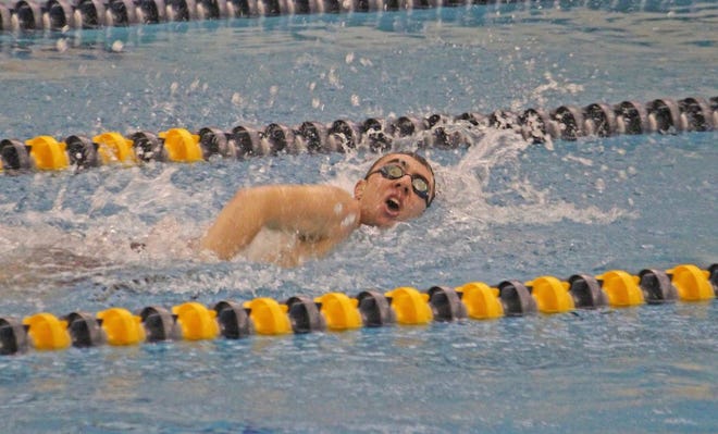 Coldwater's Kyle Krzyzanski battles his way to a second place finish in the 200 Freestyle swim Thursday.