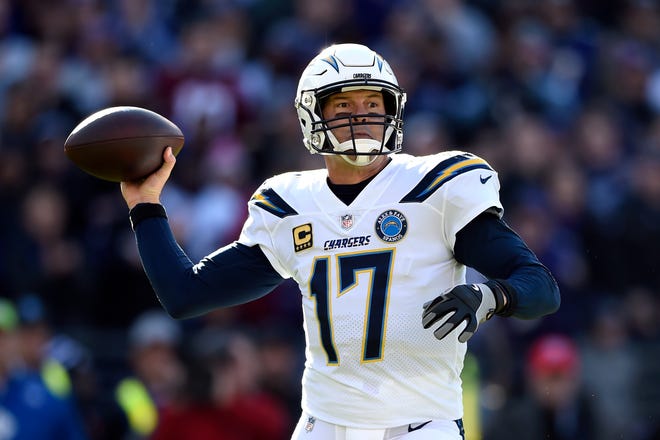 Los Angeles Chargers quarterback Philip Rivers throws a pass in the first half of an NFL wild card playoff football game against the Baltimore Ravens, Sunday, Jan. 6, 2019, in Baltimore. (AP Photo/Gail Burton)