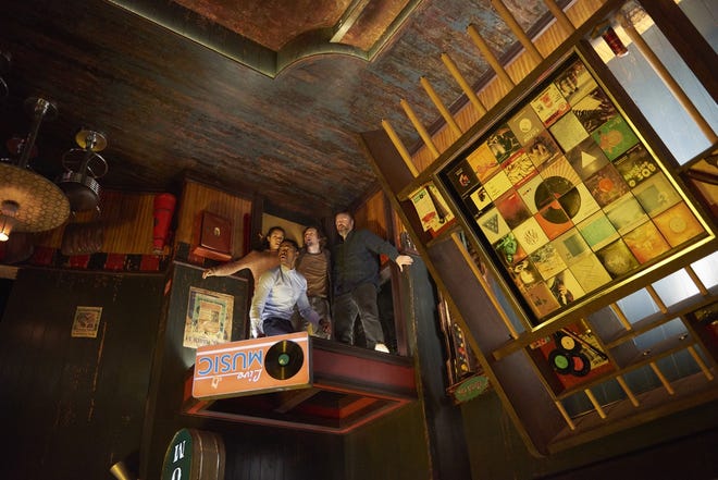 Contestants (from left, Taylor Russell, Jay Ellis, Logan Miller and Tyler Labine) find themselves in an upside-down bar in "Escape Room." [David Bloom/Sony Pictures]