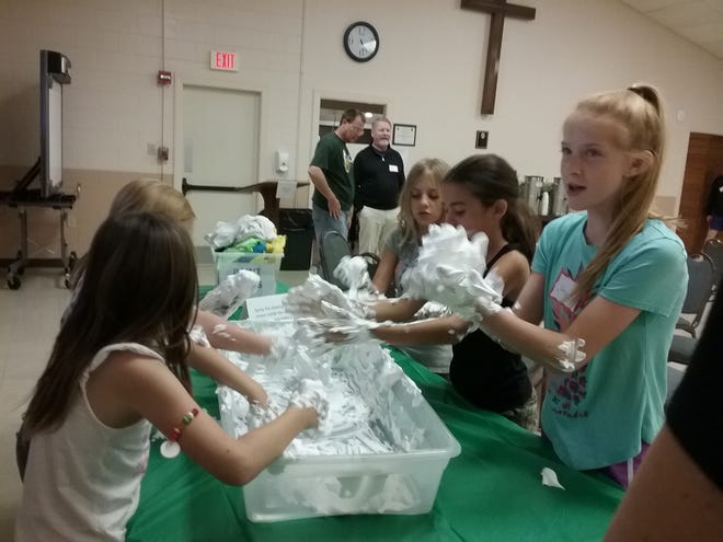 In one of the Messy Church activities, people were asked to make a snowman out of shaving cream and then they discussed how our actual celebrations do not always live up to our expectations. [Submitted]