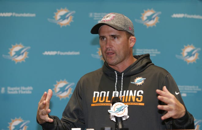 Miami Dolphins associate head coach/special teams coordinator Darren Rizzi gestures as he speaks after practice on June 5, 2017, in Davie. Rizzi is the fifth candidate to interview for their head coaching job. [AP Photo/Wilfredo Lee, File]