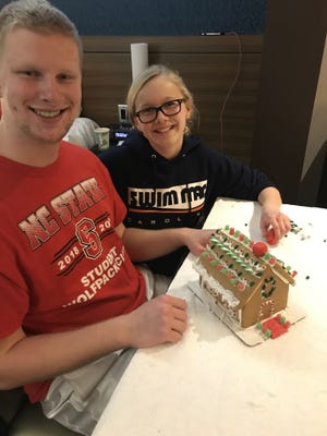 Kyle Brown and Ally Freeman with their decorated gingerbread house. [JULIE FREEMAN PHOTO]
