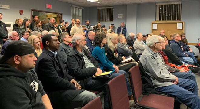 More than 80 residents attended the meeting that was standing-room-only at some points, and several voiced a range of concerns about each of the three redesigns throughout the meeting. [RACHEL ETTLINGER PHOTO]