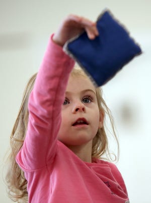 Gwen Davis, 3, dances during story time at Mauney Memorial Library in Kings Mountain on Thursday. [Brittany Randolph/The Star]