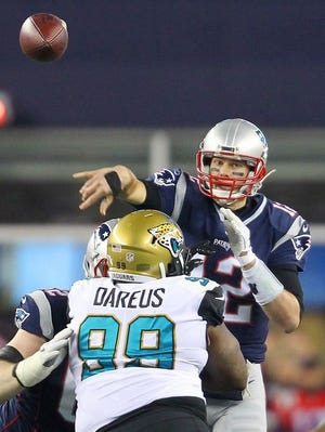 Tom Brady throwing in last year's AFC Championship game in Foxboro.