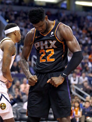 Phoenix Suns center Deandre Ayton reacts after scoring against the Denver Nuggets in the second half Saturday, in Phoenix. [AP Photo/Rick Scuteri]
