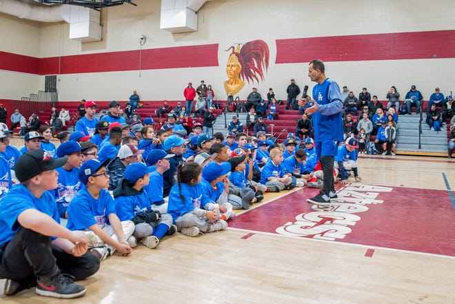 Dino Ebel talks to players during of his annual baseball clinic in Barstow on Saturday. The Dodgers third base coach returned to his alma mater along with Toronto Blue Jays pitcher Aaron Sanchez for the 10th edition of the clinic. [Robert Najera, For the Daily Press]