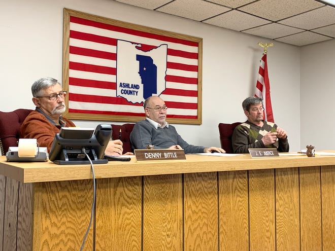 Ashland County Commissioners (left to right) Denny Bittle, Jim Justice and Mike Welch listen to Ashland County Solid Waste District coordinator Cindy Brady on Monday.
