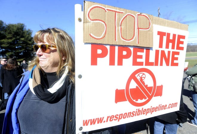 Joanne Tobas, of Upper Freehold, prepares to march in Chesterfield in 2016 against the proposed Southern Reliability Link pipeline through Northern Burlington County. An environmental group is suing Burlington County’s government as part of its ongoing efforts to prevent the construction of the pipeline. [ARCHIVE PHOTO]