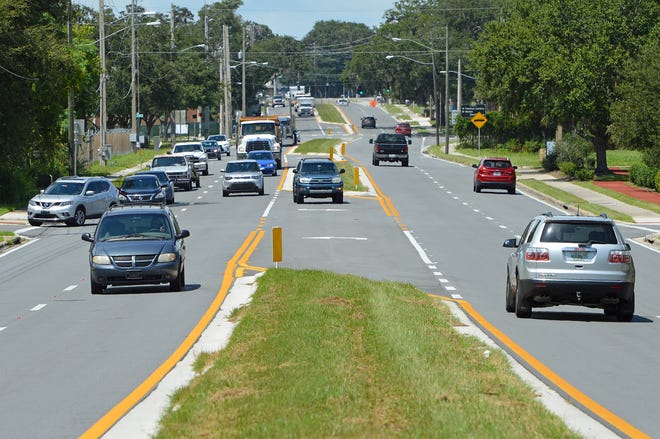 Cars travel along West Dixie Avenue on Wednesday, Aug. 29, 2018 in Leesburg. [Whitney Lehnecker/Daily Commercial]