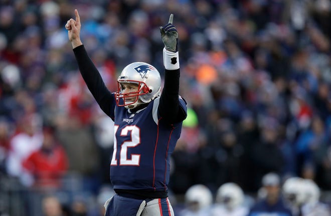 New England Patriots quarterback Tom Brady celebrates a touchdown run by running back Sony Michel during the first half of an NFL divisional playoff football game against the Los Angeles Chargers, Sunday, Jan. 13, 2019, in Foxborough, Mass. (AP Photo/Charles Krupa)