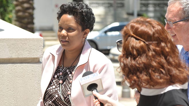 Katrina Brown enters Jacksonville's federal county before her arraignment in June. [Bob Self/Florida Times-Union]