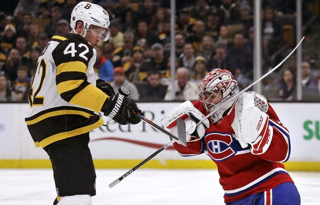 Canadiens goaltender Carey Price, right, makes a save against the Bruins' David Backes during the second period of Monday's game. [Charles Krupa/AP]