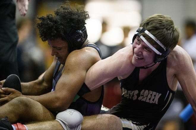 Gray's Creek's Jalen Keith and Jack Britt's Denzel Carrucini wrestle in the 160 pound finals Saturday at the 19th annual Boneyard Bash wrestling tournament at Jack Britt. Carrucini won by decision. [Andrew Craft/The Fayetteville Observer]