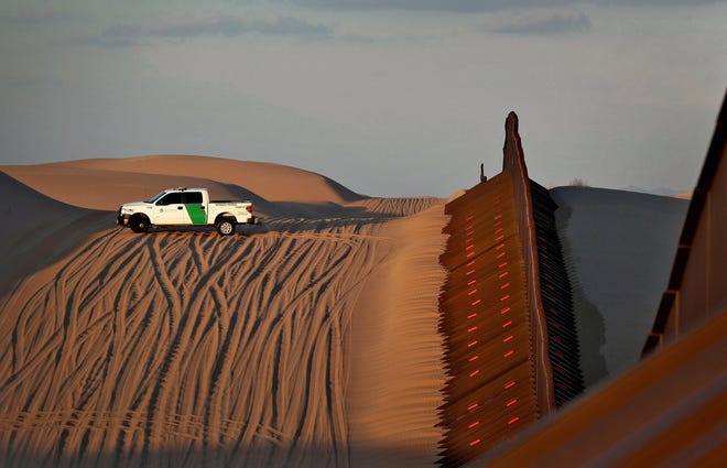 In this July 2018 file photo, a U.S. Customs and Border Patrol agent patrols a section of fence along the international border with Mexico in Imperial County, Calif. [AP PHOTO/MATT YORK]