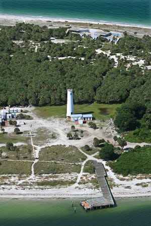 The historic Egmont Key Lighthouse was built in 1848. After several hurricanes, the lighthouse was rebuilt in 1858 and moved 90 feet to its present location. Dr. Uzi Baram, Director of the New College Public Archaeology Lab, notes that the island, which is threatened by sea level rise, is also culturally significant Native American burial ground. [HERALD-TRIBUNE ARCHIVE PHOTO]