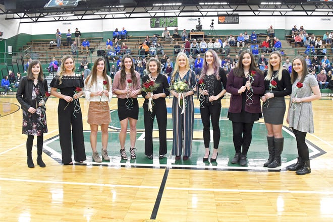 Maddie Keener (center, white roses) was crowned homecoming queen and Hazelyn Smith (center, red roses) named princess at the basketball game between Smithville and Northwestern on Jan. 11. Keener is the daughter of Andy and Pam Keener. Smith is the daughter of Barry and Melissa Craemer Smith. Following the game, students attended Winter Overtime where they could eat pizza, participate in karaoke, play ping-pong, 9-square, basketball and table games. Members of the homecoming court (single roses) were Morgan DeRodes (left), Emma Feil, Kirstyn Thut, Lauryn Thut, Kate Larson, Melissa Langston, Payton Seckel and Shalen Guilliams.