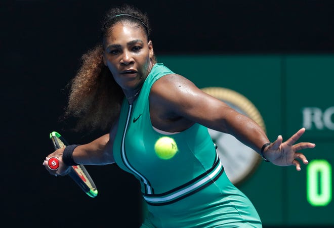 Serena Williams hits a forehand return to Tatjana Maria during their first-round match Tuesday at the Australian Open. [Kin Cheung/The Associated Press]