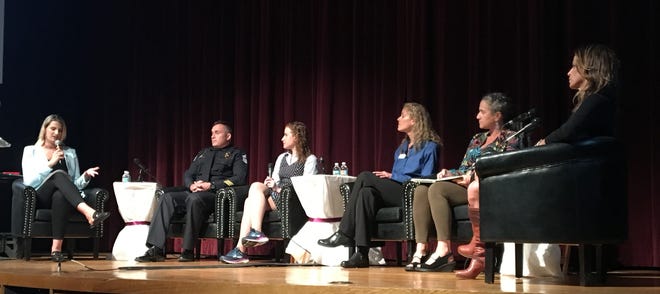 SNN anchor Hallie Peilet moderates the panel of mental health "experts" at the "One Thing I Wish You Knew" event, including (from left) Lt. Richie Schwieterman of the Sarasota Police Department; Dr. Stacy Greeter, child psychiatrist; Karen Loard, supervisor of clinical services for Jewish Children and Family Services; Amy Weinberger of The Thinking Center; and parent and founder of the Brandi's Wish Foundation, Sheryl Isaac. [HERALD-TRIBUNE STAFF PHOTO / CARRIE SEIDMAN]
