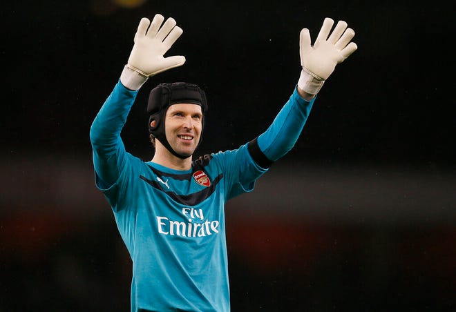 Arsenal's Petr Cech waves to fans after the English Premier League soccer match between Arsenal and Newcastle United at Emirates stadium in London on Jan. 2, 2016. Petr Cech says he is planning to retire from soccer at the end of the season. (AP Photo/Kirsty Wigglesworth, file)