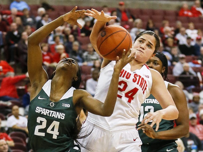 Ohio State's Makayla Waterman, right, battles Michigan State's Nia Clouden for a rebound during Monday's game. Waterman says the focus this season is outworking the opponent. [Tyler Schank/Dispatch]
