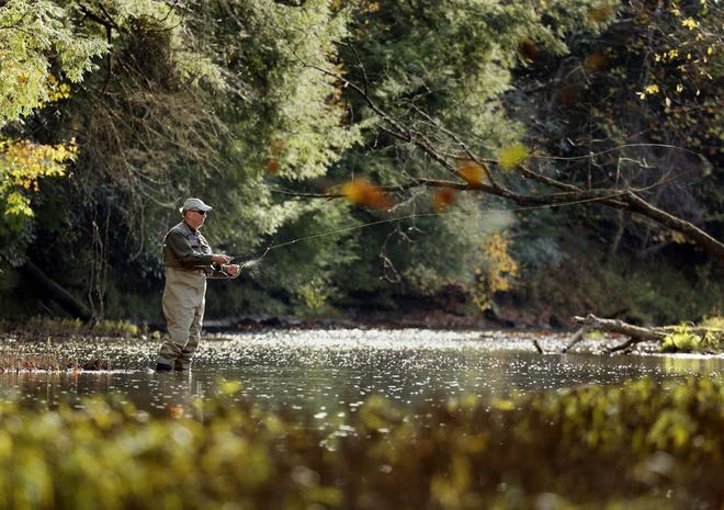 Clyde Chilcote of Logan casts a line in the Clear Creek at Clear Creek Metro Park on October 28, 2016. [Eric Albrecht/Dispatch file photo]