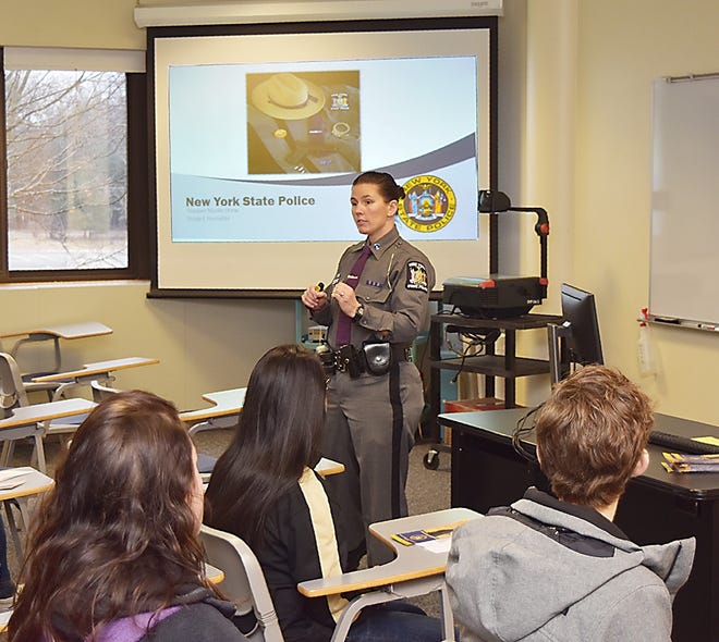 Nicole Drew, a recruiter with the New York State Police, speaks to Corning-Painted Post High School Students at a Career Day event organized by the Career Development Council and held Tuesday at Corning Community College. [James Post/The Leader]