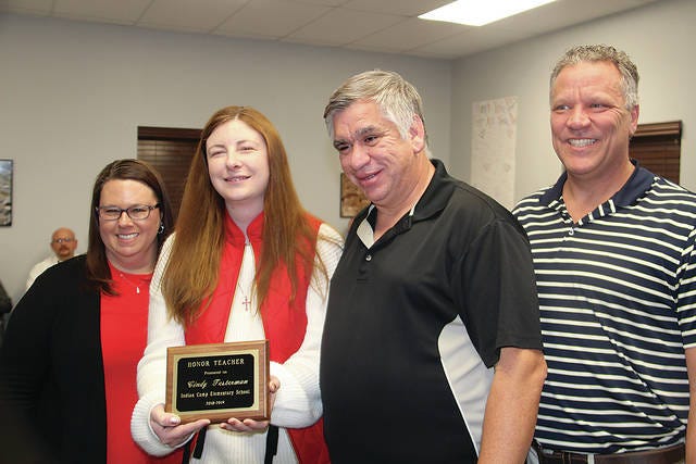 Indian Camp Elementary School teacher Cindy Testerman has been chosen Honor Teacher for Indian Camp for 2018-19, and Teacher of the Year for Pawhuska Public Schools. She is shown here with her principal and district officials. Pictured are, from left, Indian Camp Principal Amy Sanders, Teacher of the Year Cindy Testerman, Board of Education member Tom Boone and Pawhuska Superintendent David Cash. Robert Smith/Journal-Capital