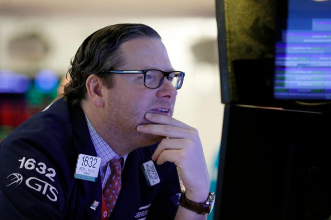 Specialist Gregg Maloney works on the floor at the New York Stock Exchange. [AP file photo]