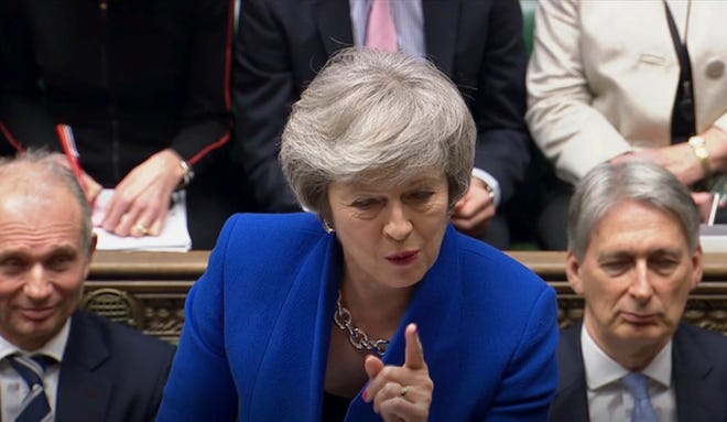 Britain's Prime Minister Theresa May speaks during Prime Minister's Questions in the House of Commons, London, Wednesday Jan. 16, 2019. In a historic defeat for the government Tuesday, Britain's Parliament discarded May's Brexit deal to split from the European Union, and May now faces a parliamentary vote of no-confidence later Wednesday. (House of Commons/PA via AP)
