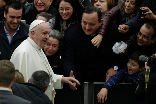Pope Francis arrives in the Paul VI hall on the occasion his weekly general audience at the Vatican, Wednesday, Jan. 16, 2019. (AP Photo/Gregorio Borgia)
