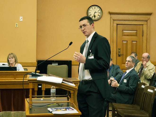 Justin Grady, Kansas Corporation Commission chief of accounting and financial analysis, speaks Wednesday for the second day to the Kansas Senate utilities committee, offering facts about the state's high electric rates. [Morgan Chilson/The Capital-Journal]