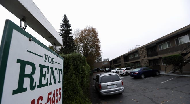A "For Rent" sign is shown at an apartment complex. [AP FILE PHOTO BY DON RYAN]
