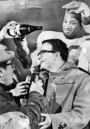 Kansas City Chiefs linebacker Bobby Bell pours champagne over the head of team owner Lamar Hunt after the Chiefs beat the Buffalo Bills to win the AFL Championship Game in Buffalo, N.Y., on Jan. 1, 1967. [The Kansas City Star file photo via AP]