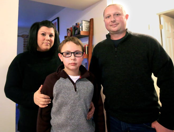 Lindsay Scott, pictured with her Coast Guard husband, and their son, Conner, 11, speaks to the impact of the government shutdown on her family. [Ioanna Raptis/Seacoastonline]
