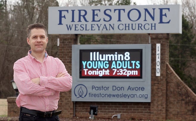 Firestone Wesleyan Church Pastor Don Avore poses outside the sanctuary's sign at 1700 Union Road on Tuesday afternoon, Jan. 15, 2019. The church will break ground soon on a large, 9,150-square-foot multipurpose center that will be adjacent to its existing 12,000-square-foot sanctuary. [Mike Hensdill/The Gaston Gazette]