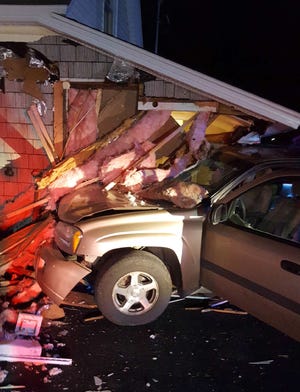 A Chevrolet Trailblazer driven by a 16-year-old juvenile crashed into a home in Epping Saturday. Police said the driver lost control of her vehicle as she attempted to turn onto Route 125. [Epping police photo]