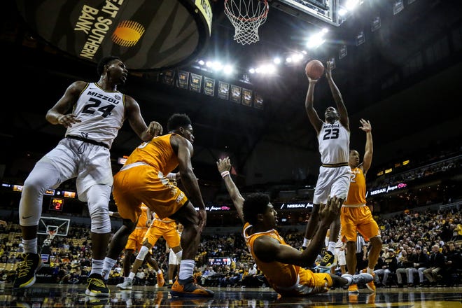 Missouri forward Jeremiah Tilmon (23) is called for a charge on Tennessee forward Kyle Alexander (11) during a game at Mizzou Arena on Tuesday, Jan. 8. [Hunter Dyke/Tribune]