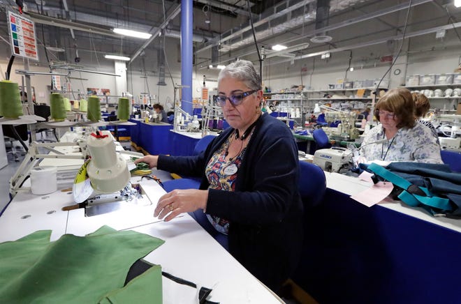 In this Wednesday, Jan. 9, 2019 photo, tailors sew costume pieces for performers at Walt Disney World in Lake Buena Vista, Fla. The department makes 10,000 costume pieces with the help of 300 sewers and six designers. (AP Photo/John Raoux)