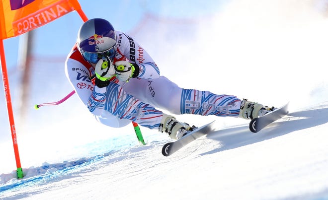 United States' Lindsey Vonn speeds down the course during an alpine ski, women's World Cup downhill in Cortina D'Ampezzo, Italy, Friday, Jan. 18, 2019. (AP Photo/Marco Trovati)