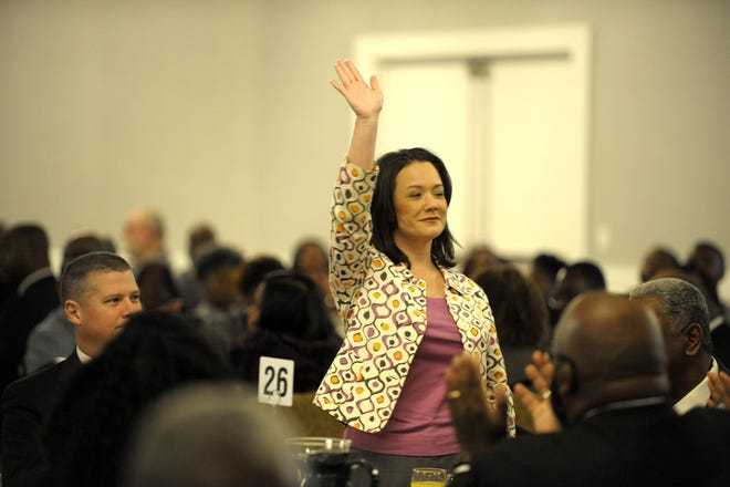 Councilwoman Anna Brosche waves after being introduced to the crowd at a breakfast honoring Martin Luther King Jr. on Friday morning. [Dede Smith/For the Times-Union]