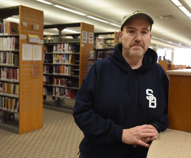 Furloughed federal worker Bob Camara is seen at Somerset Public Library after donating some books and DVDs there Friday, Jan. 18. [Herald News Photo | Jack Foley]