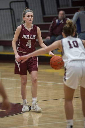 Millis High School sophomore, Abby Miller (l), brings the ball up court during Friday evening's game versus Dedham High School at Dedham High School, January 18, 2019.

[Wicked Local Local/Sean Browne]