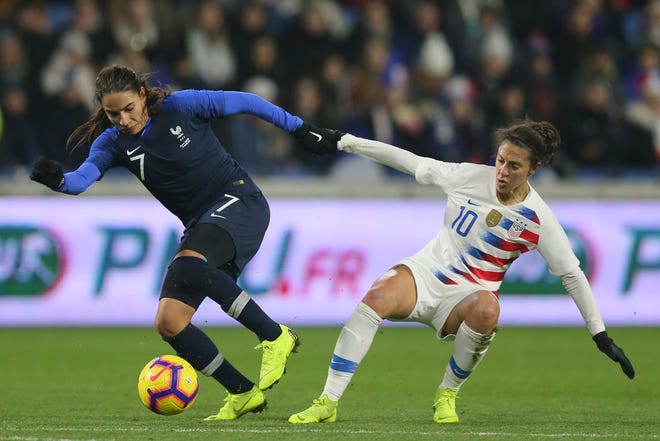 France defender Amel Majri, left, vies for the ball with US forward Carli Lloyd during a women's international friendly match Saturday. France won 3-1. [David Vincent/Associated Press]