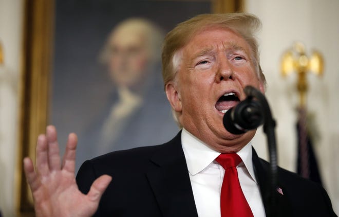President Donald Trump speaks about the partial government shutdown, immigration and border security in the Diplomatic Reception Room of the White House, in Washington, Saturday. [AP Photo/Alex Brandon]