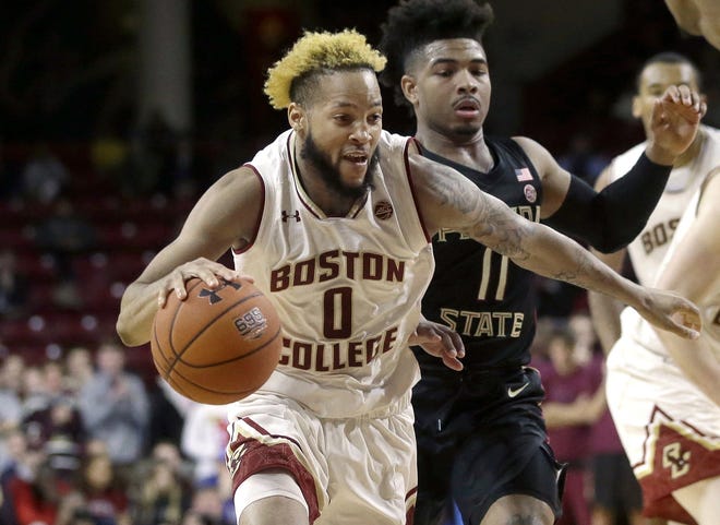 Boston College's Ky Bowman (0) drives past Florida State's David Nichols during Sunday's game in Boston. [Steven Senne/Associated Press]