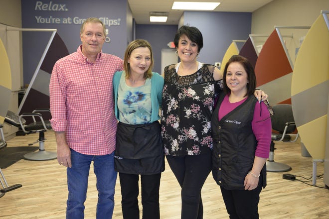 Owner Randy Forbes, Theresa Boggs, Manager Bonnie Snow and Angelica Valdiviez of Great Clips in Groveland are offering free haircuts to any federal employee who recived $0.00 on a paycheck since the goverment shutdown in December. [Cindy Sharp/Correspondent]