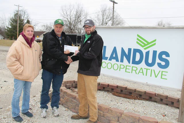 From left, Betty Niles, Ken Cavanaugh and Tony Friedrichsen pose for a photo outside Landus Cooperative. Landus gave $850 to the Woodward Fire Department to go toward the purchase of a new defibrillator. PHOTO BY ALLISON ULLMANN/THE PERRY CHIEF