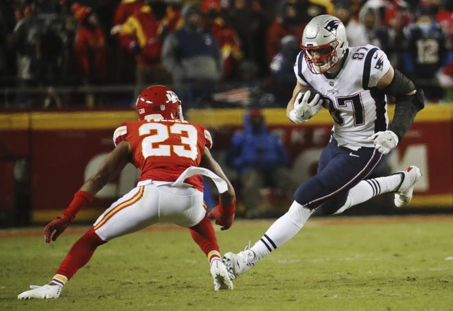 New England Patriots tight end Rob Gronkowski (87) runs against Kansas City Chiefs cornerback Kendall Fuller (23) during the first half of the AFC Championship NFL football game, Sunday, Jan. 20, 2019, in Kansas City, Mo. (AP Photo/Charlie Riedel)